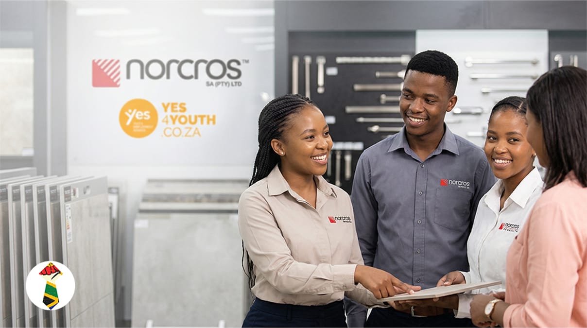 A team of three young South African sales learners assisting customers in a Norcros SA retail branch environment.